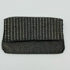 Vintage black clutch with metal toned beading